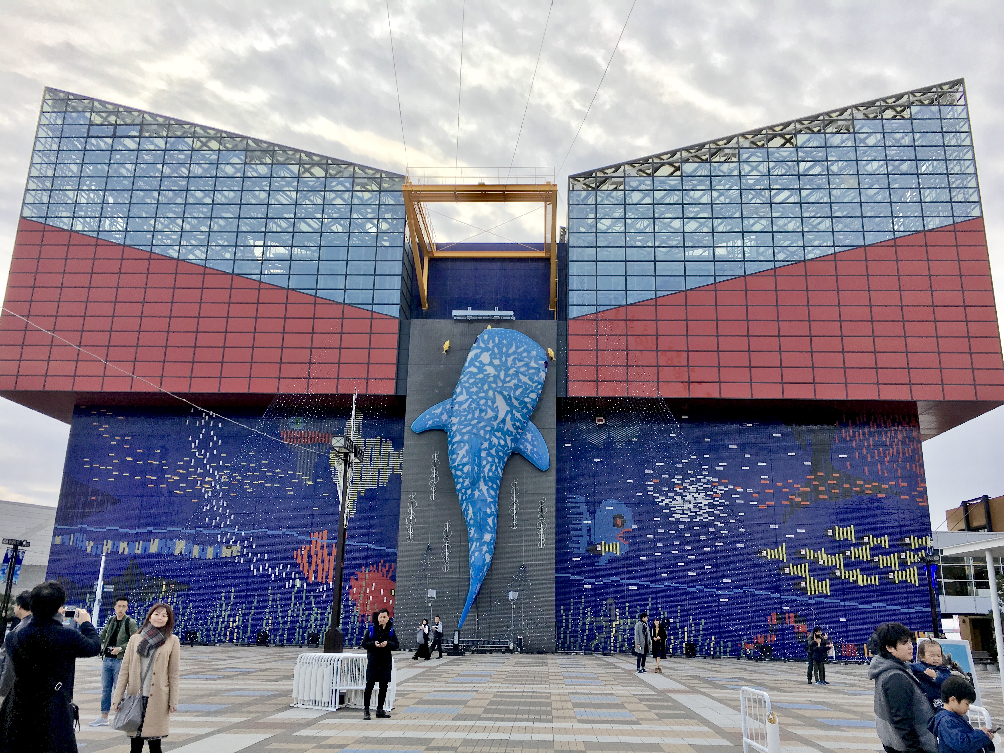blue and red building of the Osaka Kaiyukan with a big whale shark on the front 