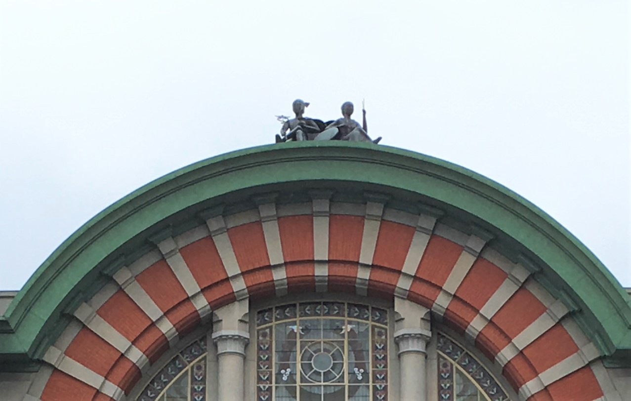 metal statues of hermes and athena atop Osaka City Public Hall
