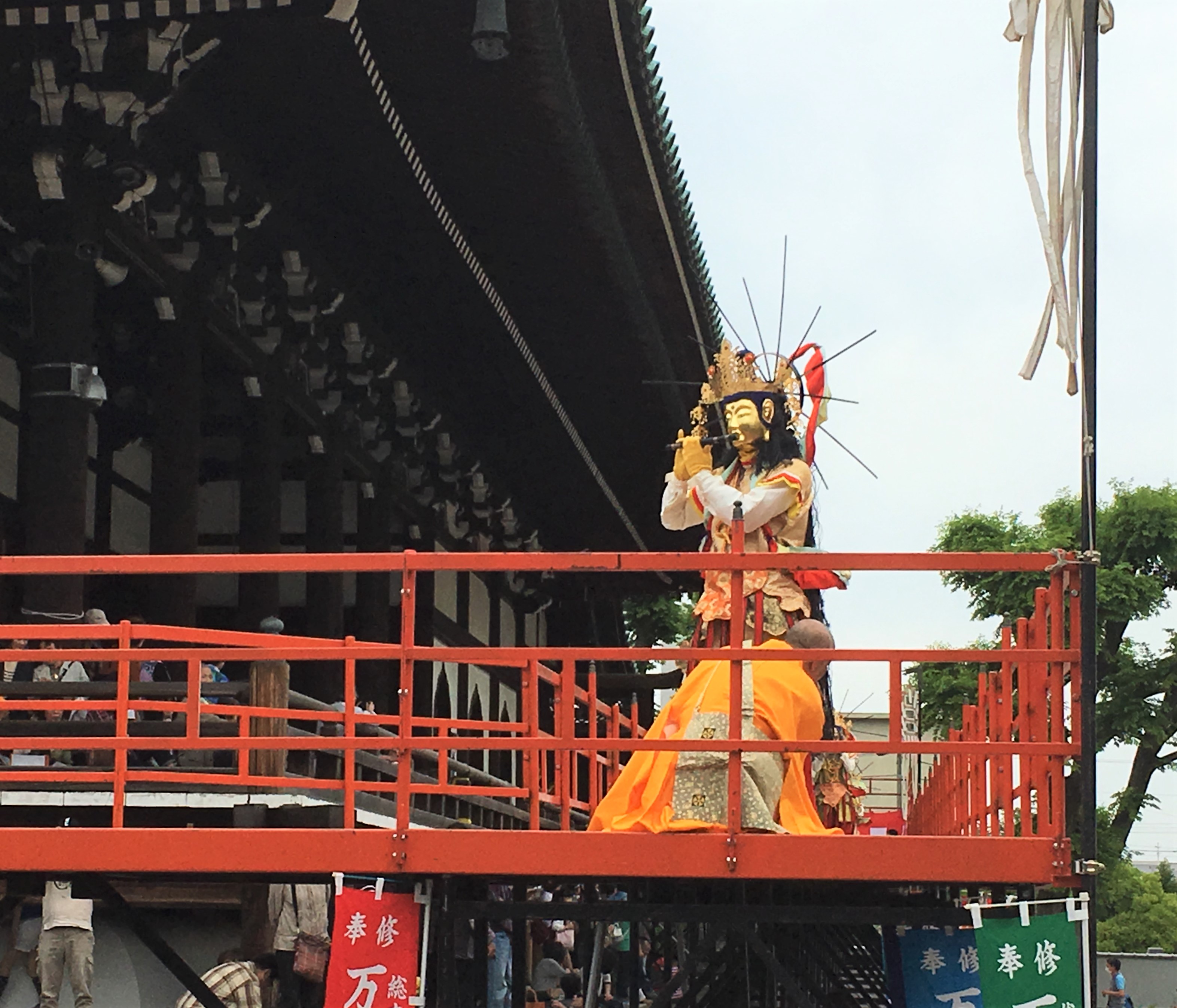 Man dressed in golden buddha mask during the Manbu Oneri Fersival