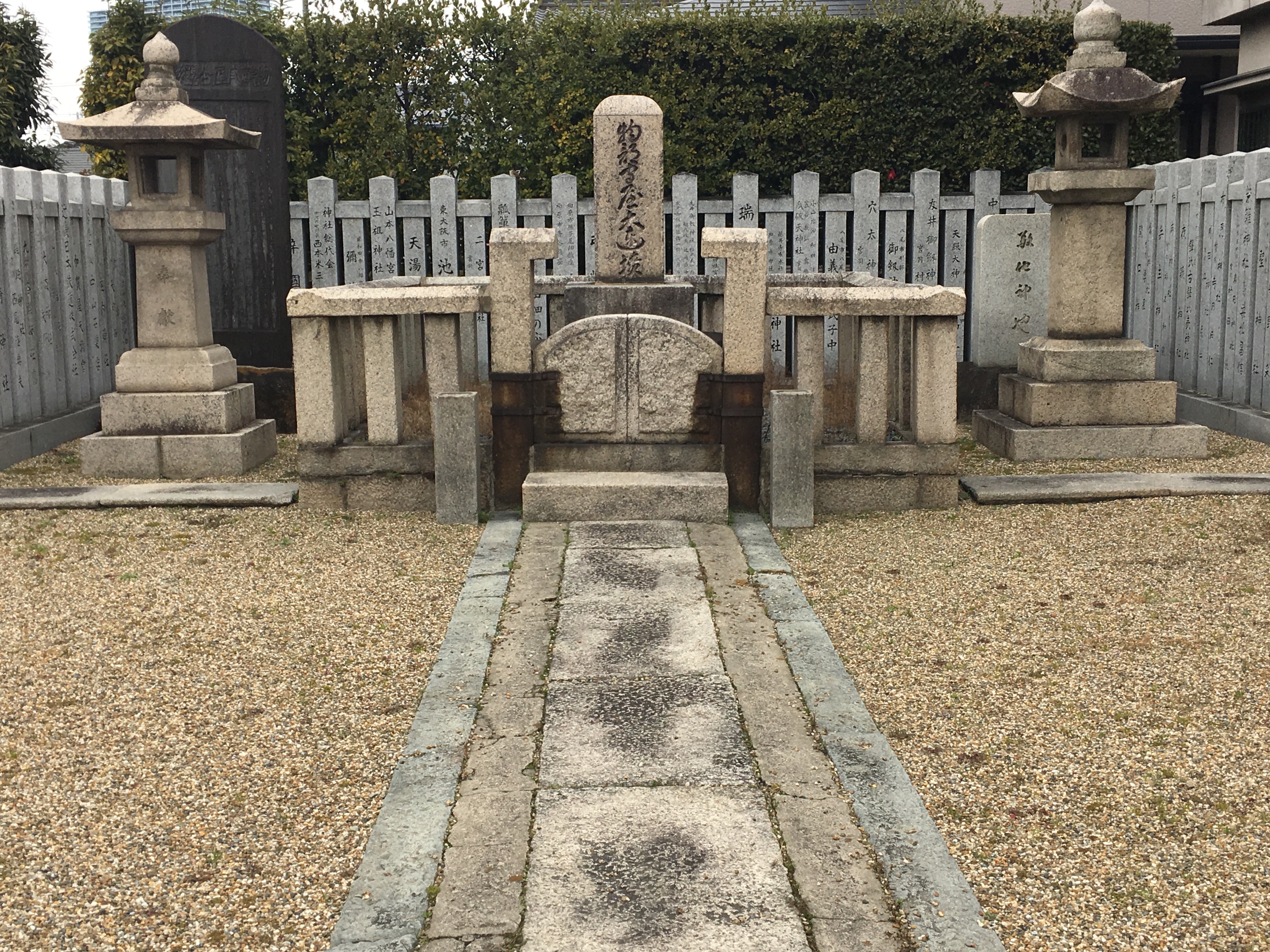 stone grave of Moriya no Mononobe surrounded by stone pillars 