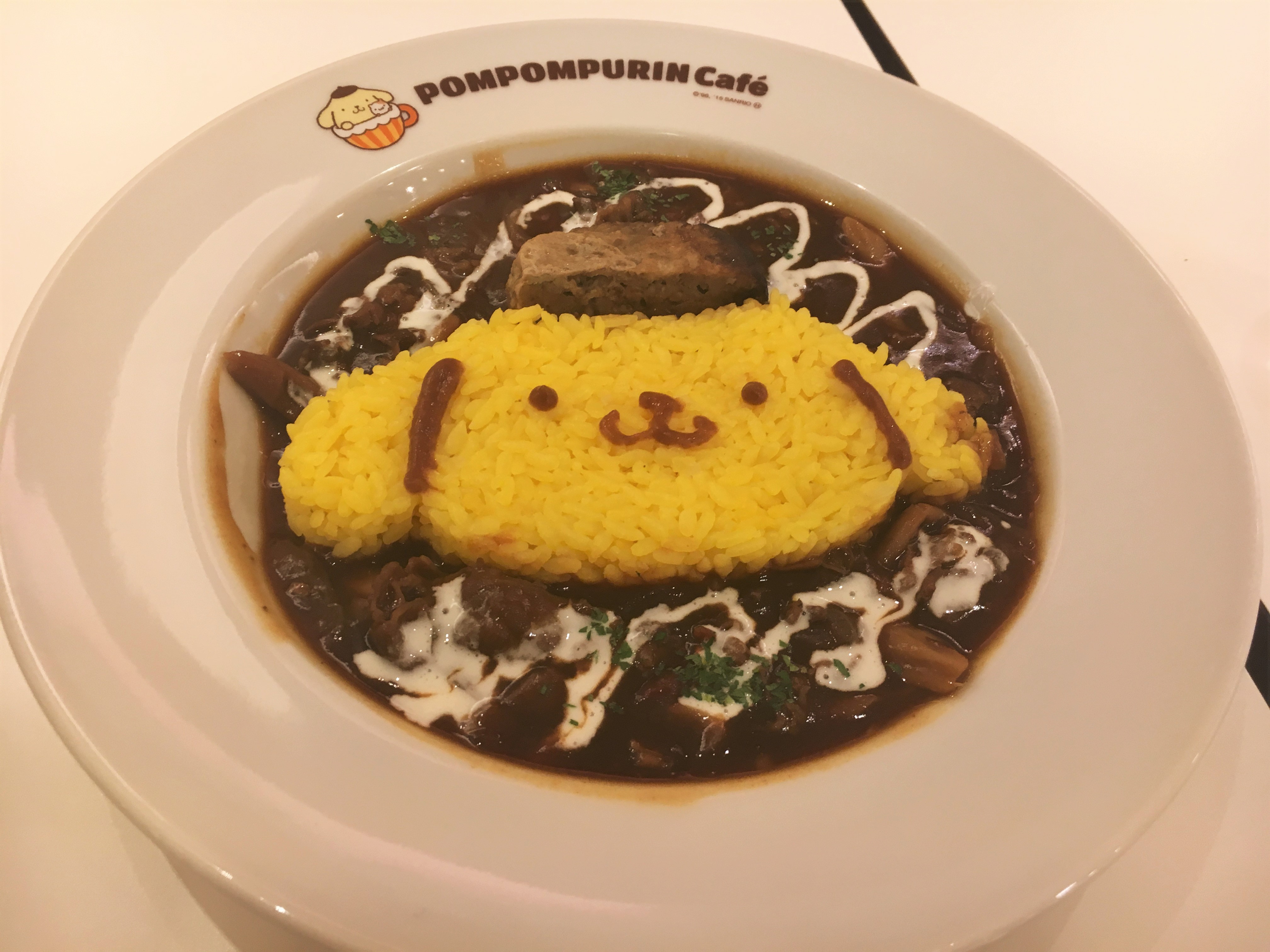 beef stroganofff with yellow rice in the shape of pompompurin 