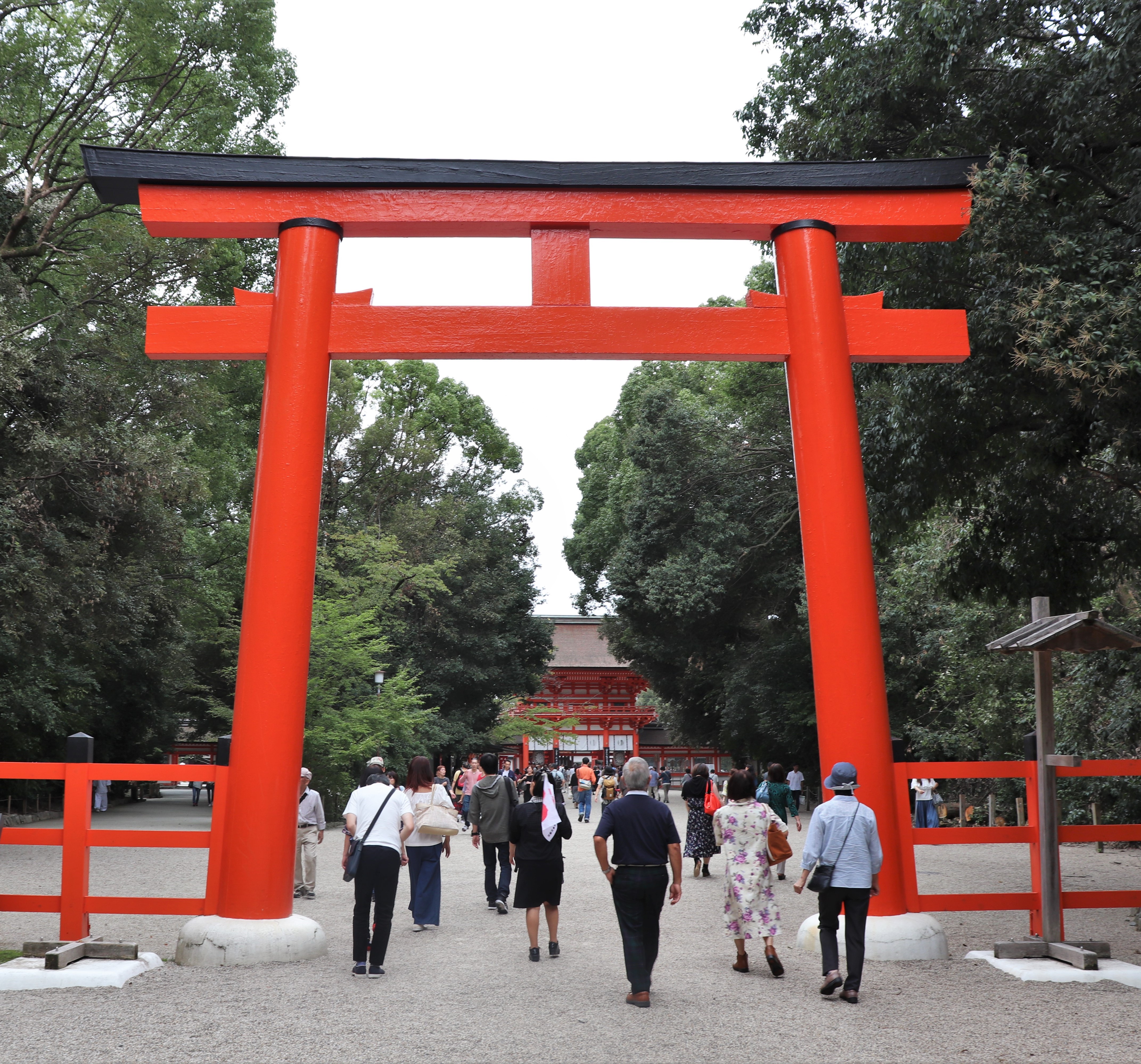 Large bright red torii entrance of Shimogamo Shrine