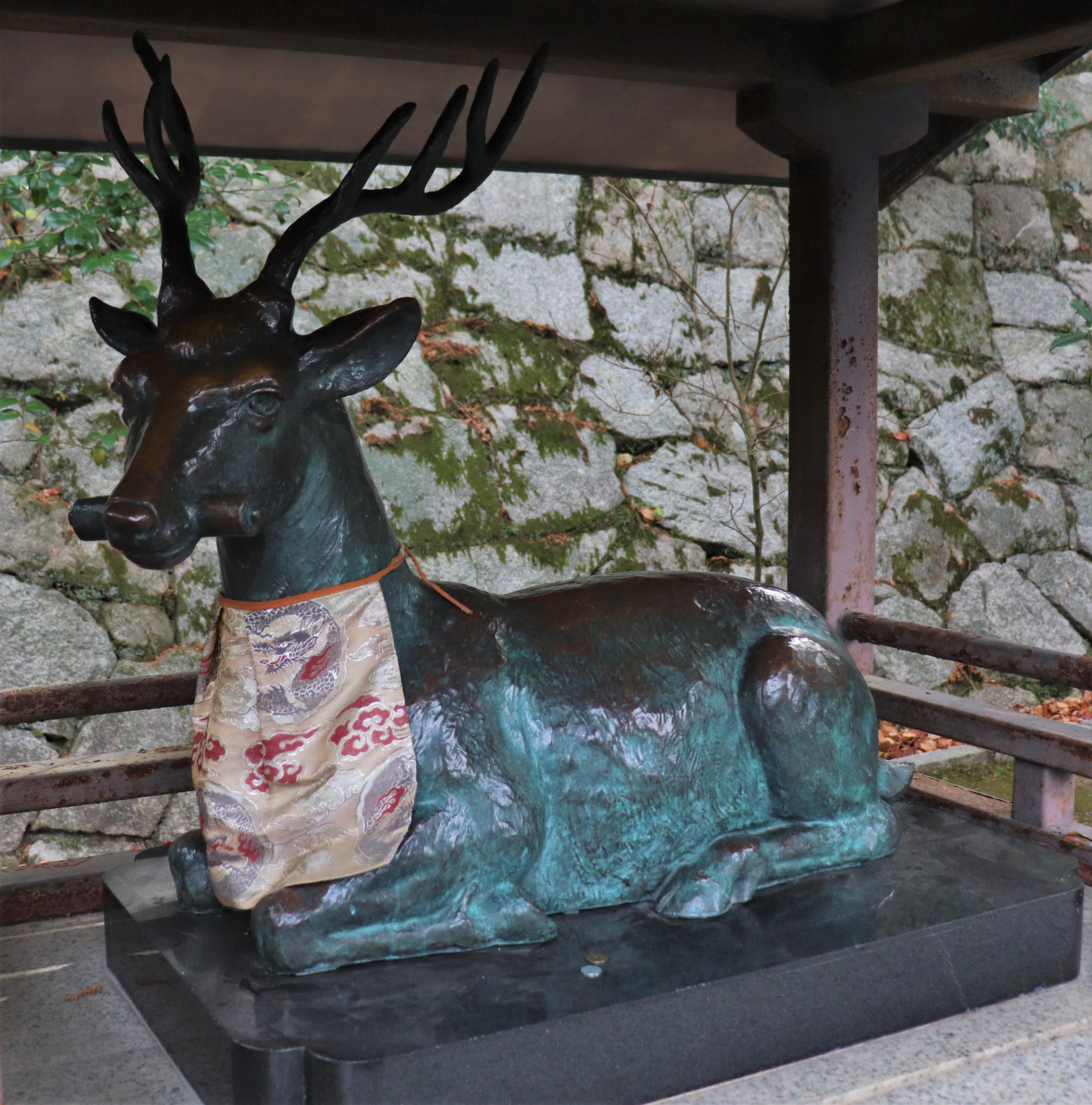 bronze statue of a deer in Yoshida Shrine.