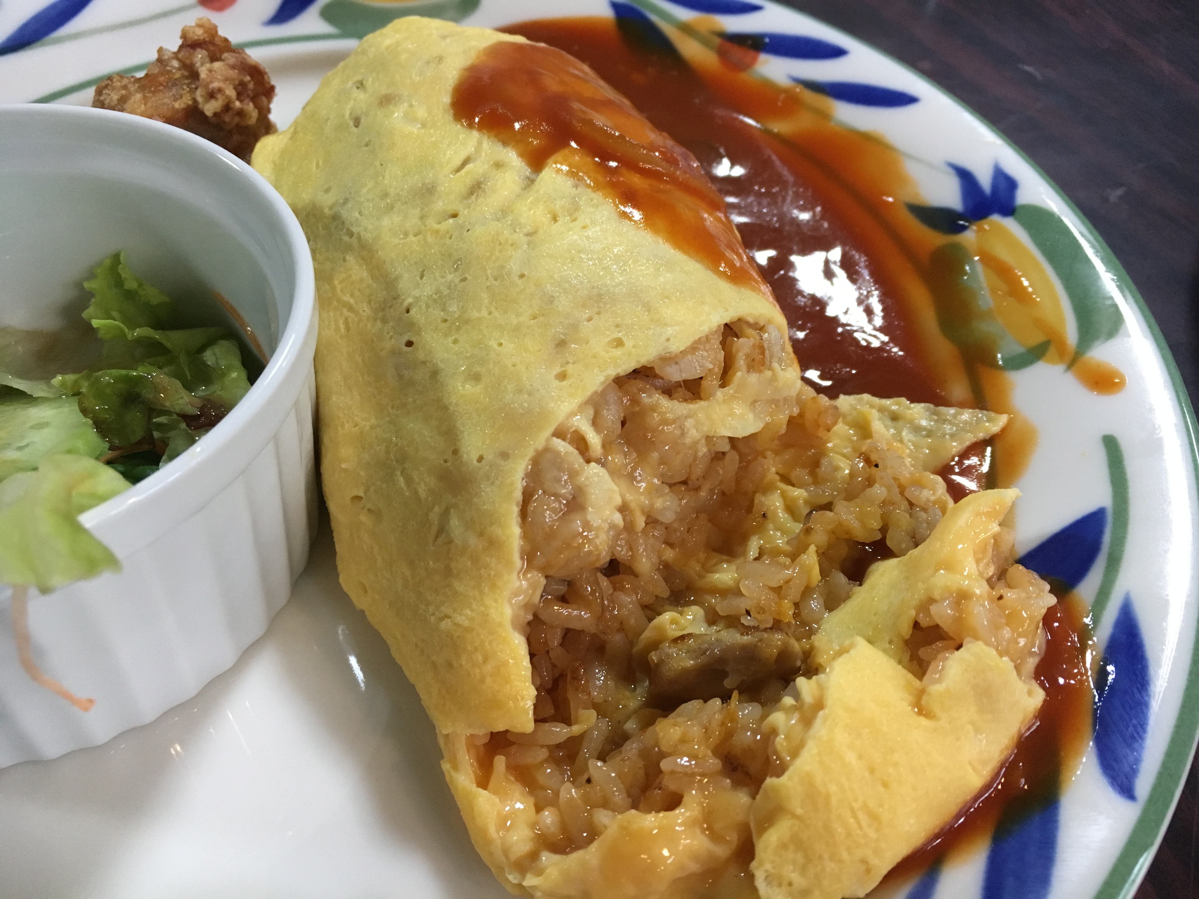 inside of omurice with a side of sauce