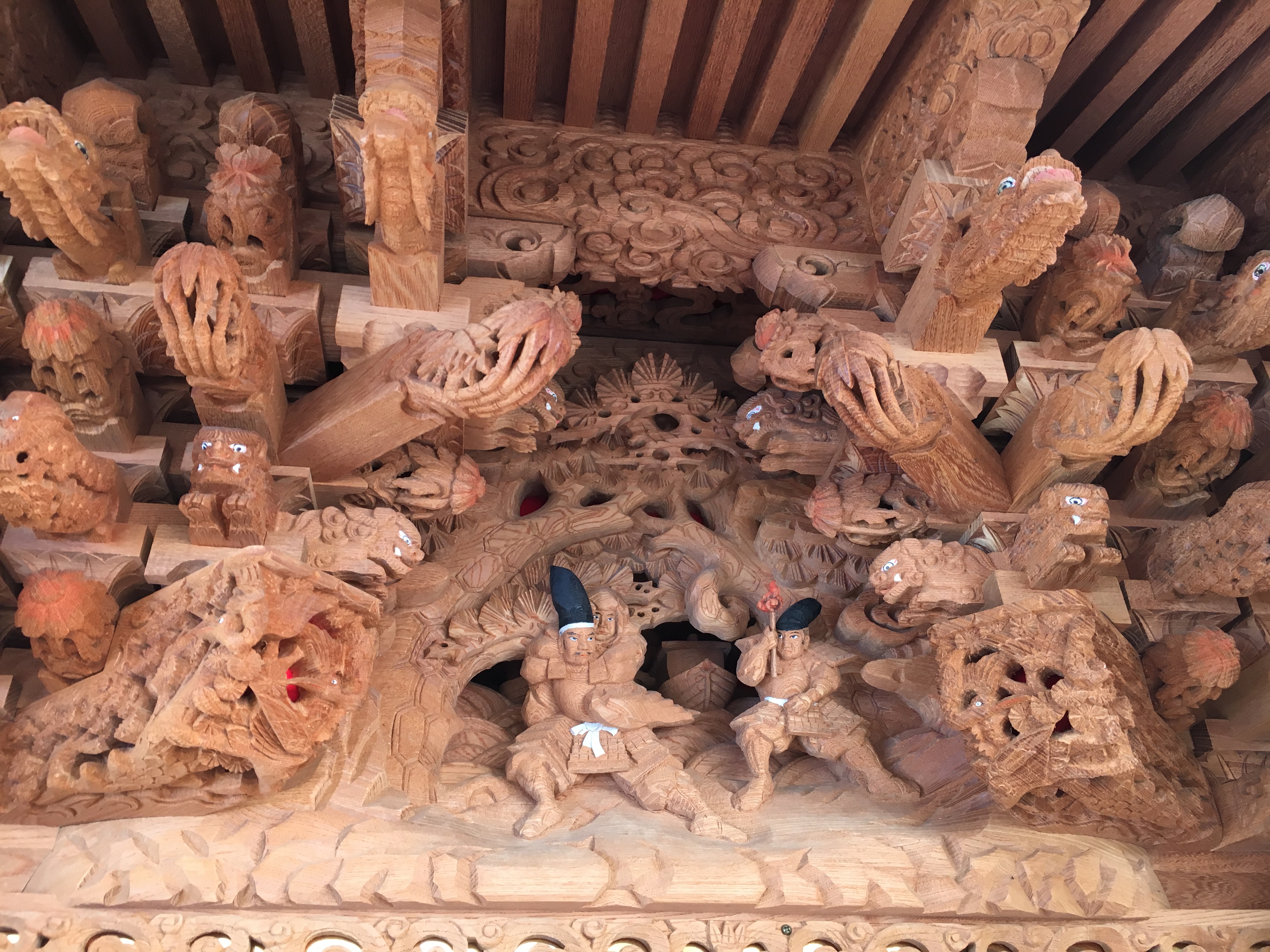 close up of elaborate wooden carvings of a danjiri during Osaka's danjiri festivals