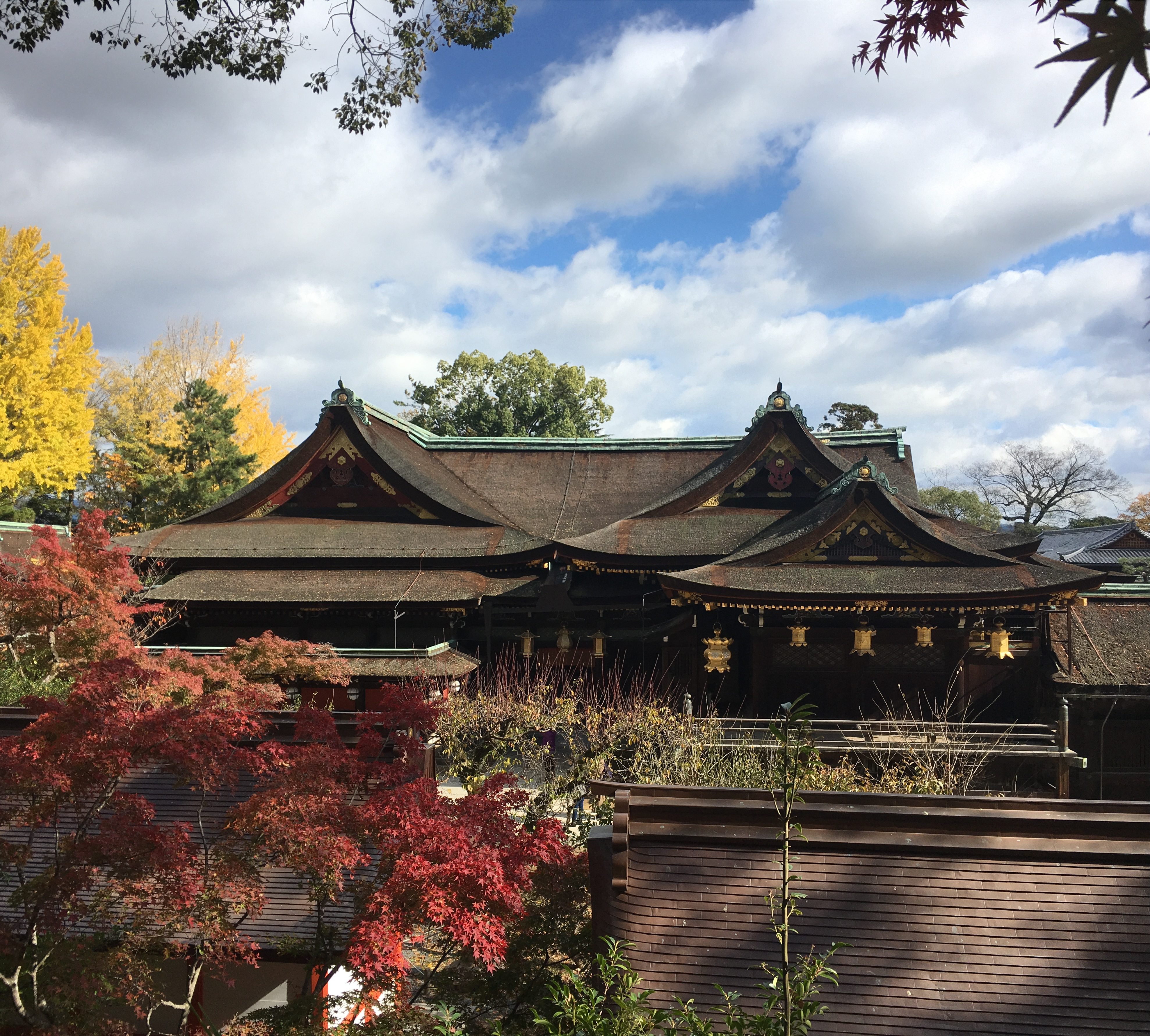 Kitano Tenmangu's honden from a distance surrounded by fall colors