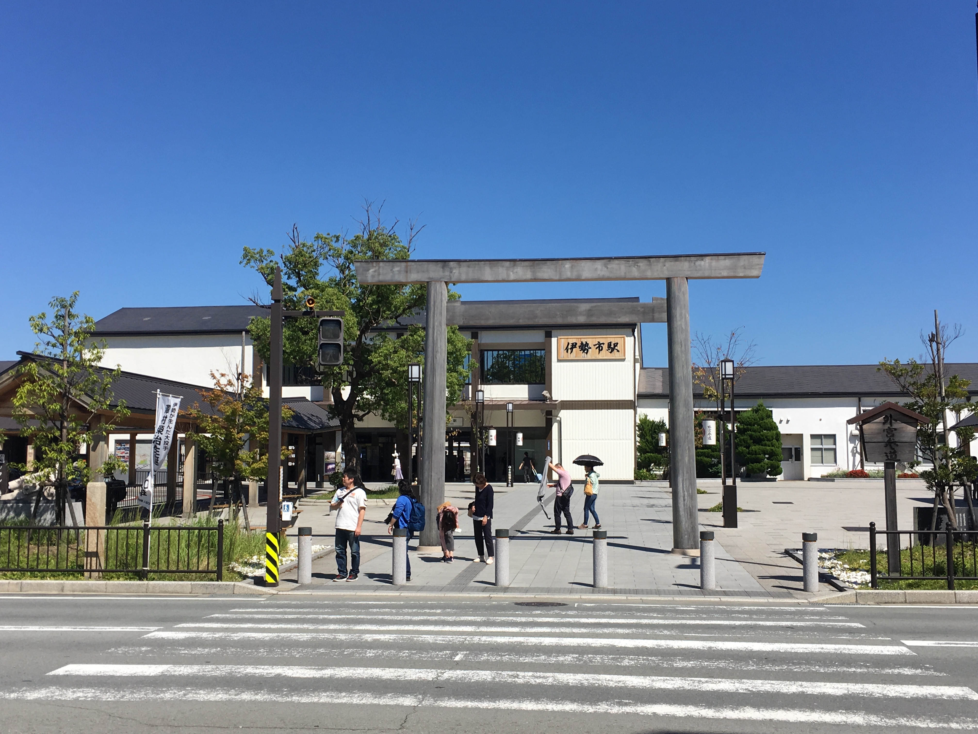 Torii infront of train station in Ise City on a clear day