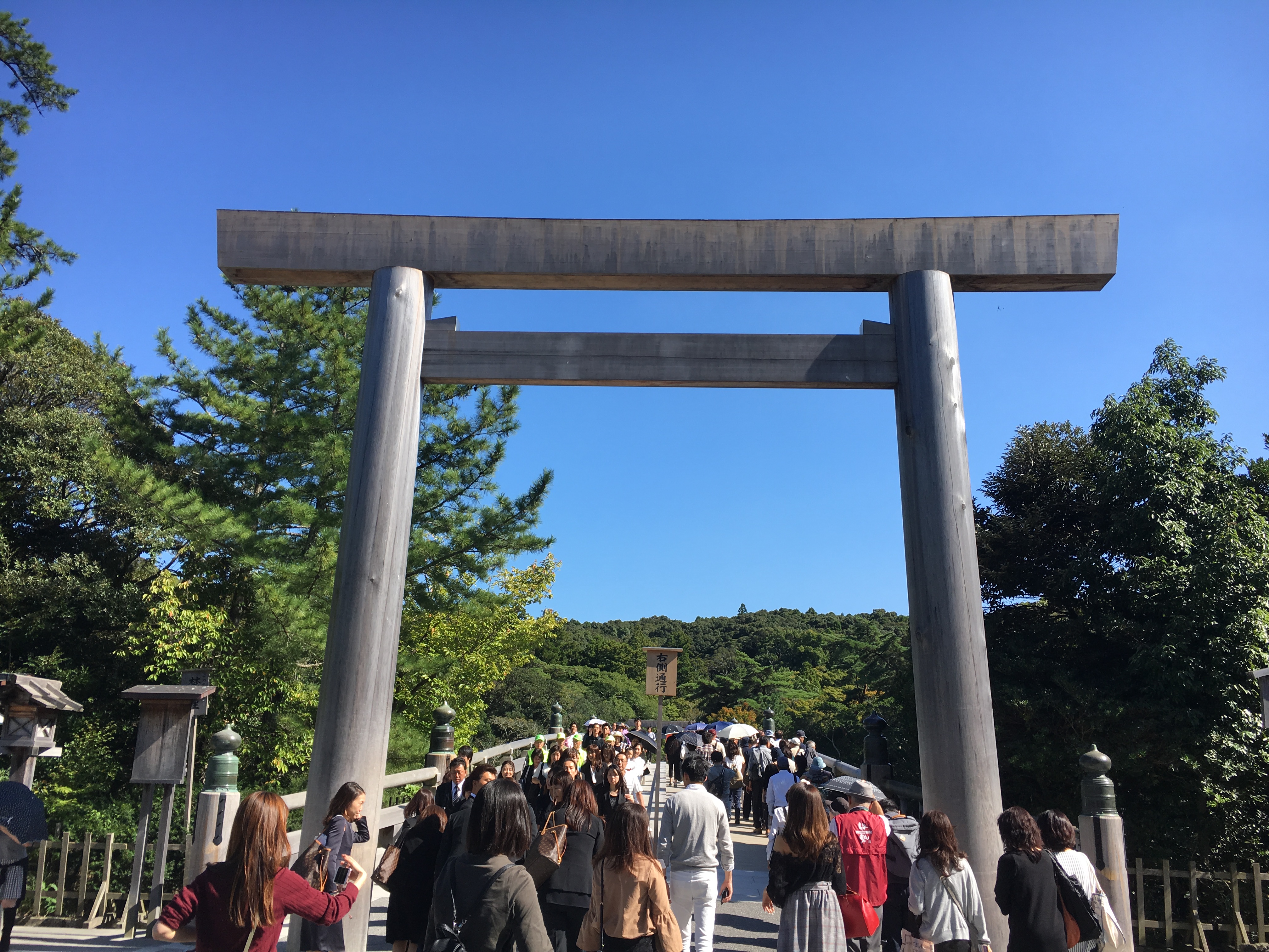 Uji-bashi bridge in Ise Grand Shrine as tourists walk over it during the day