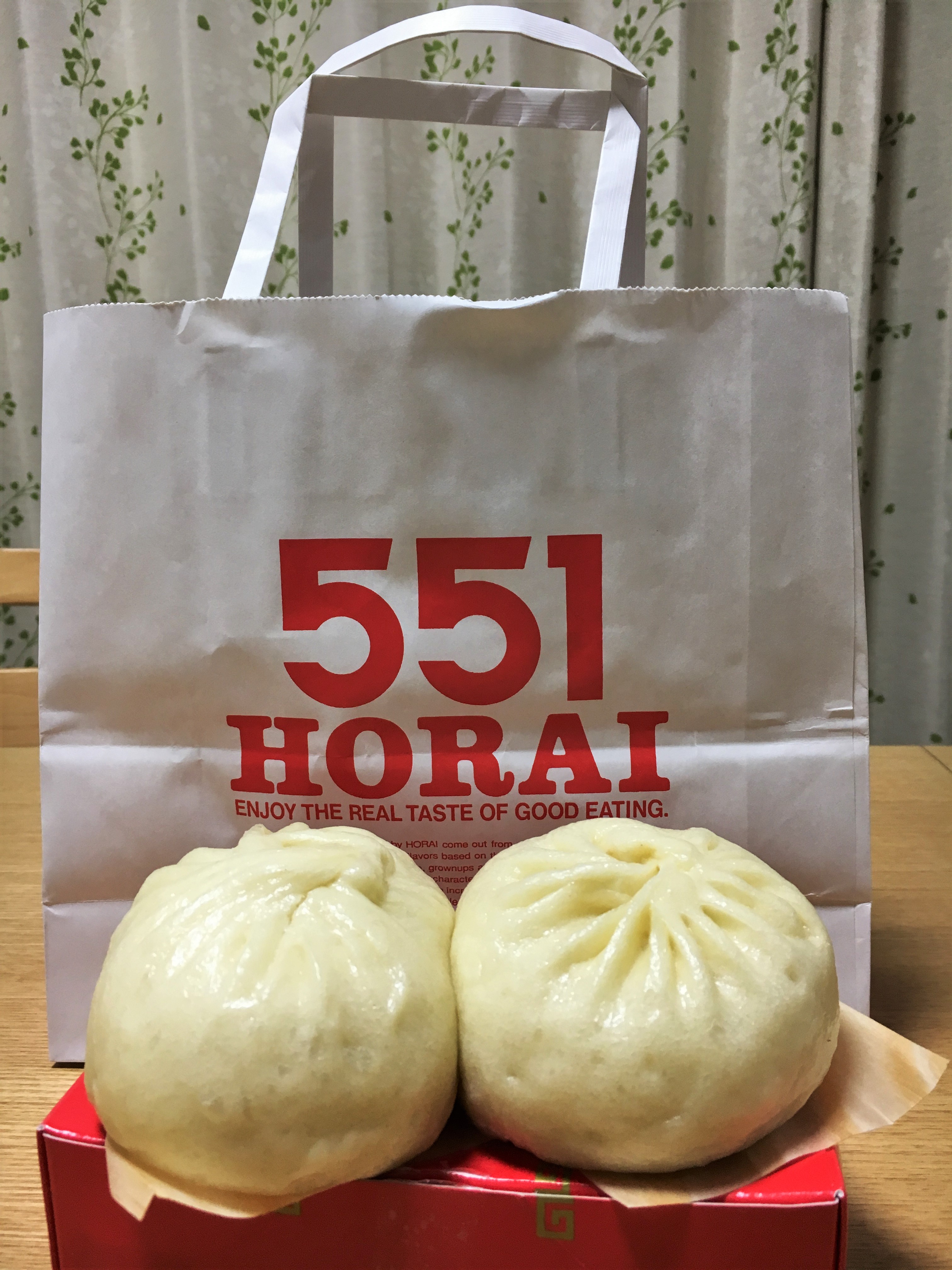 red and white bag from 551 Horai with two big fluffy butaman on red box