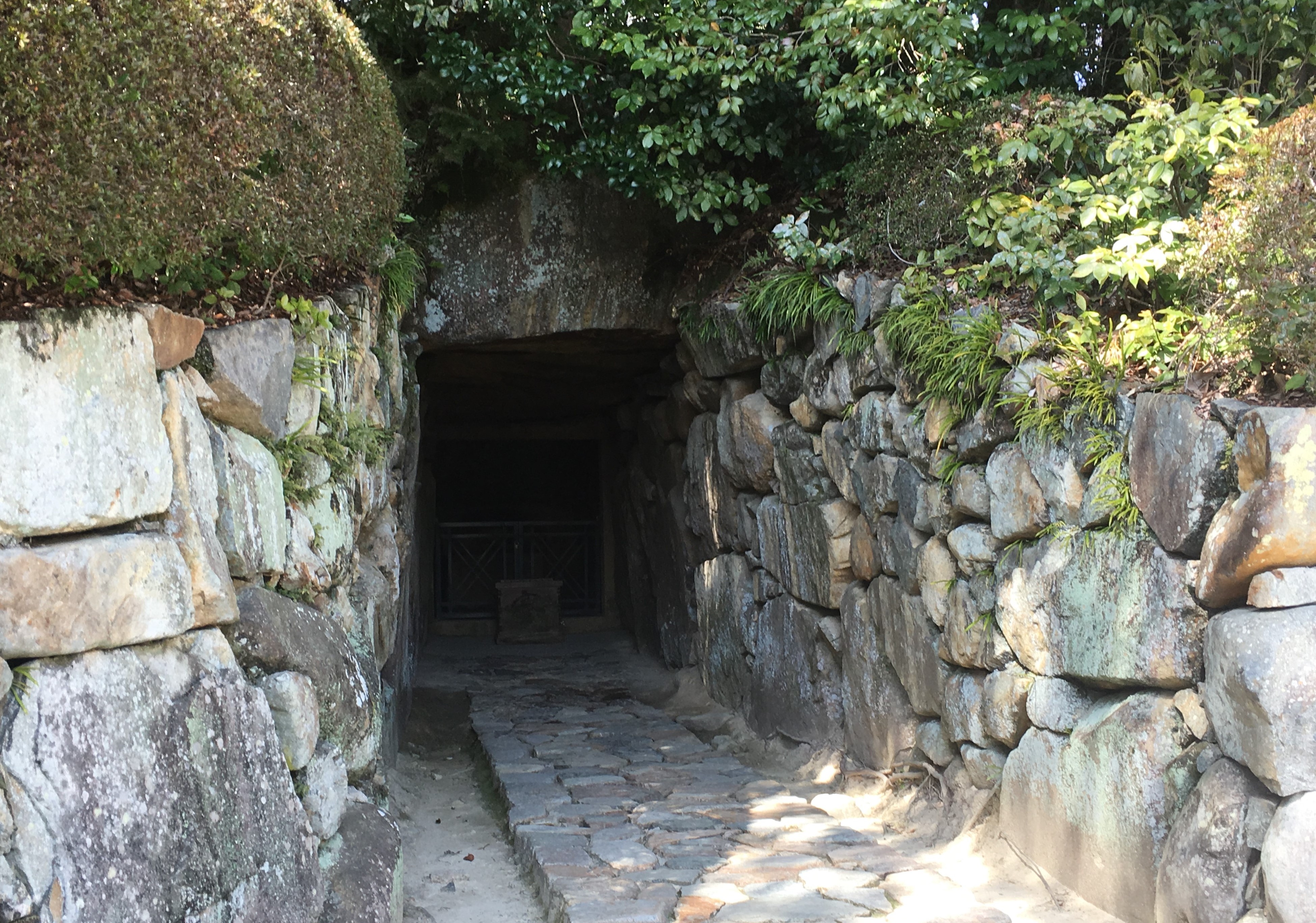 stony path leading to dark entrance of Nakayama-dera Kofun