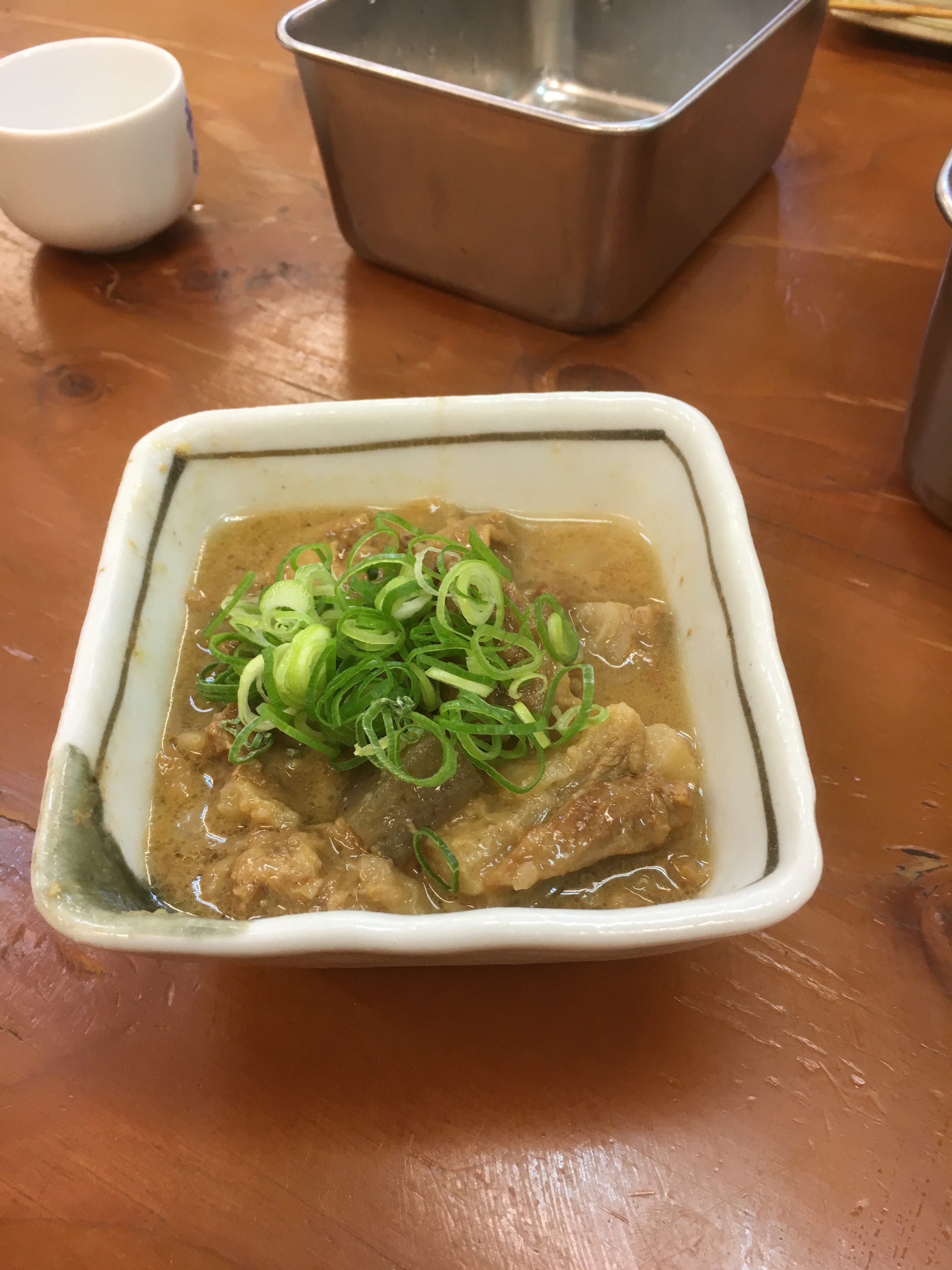 Doteyaki, beef tenderloin marinated with miso and topped with green onions