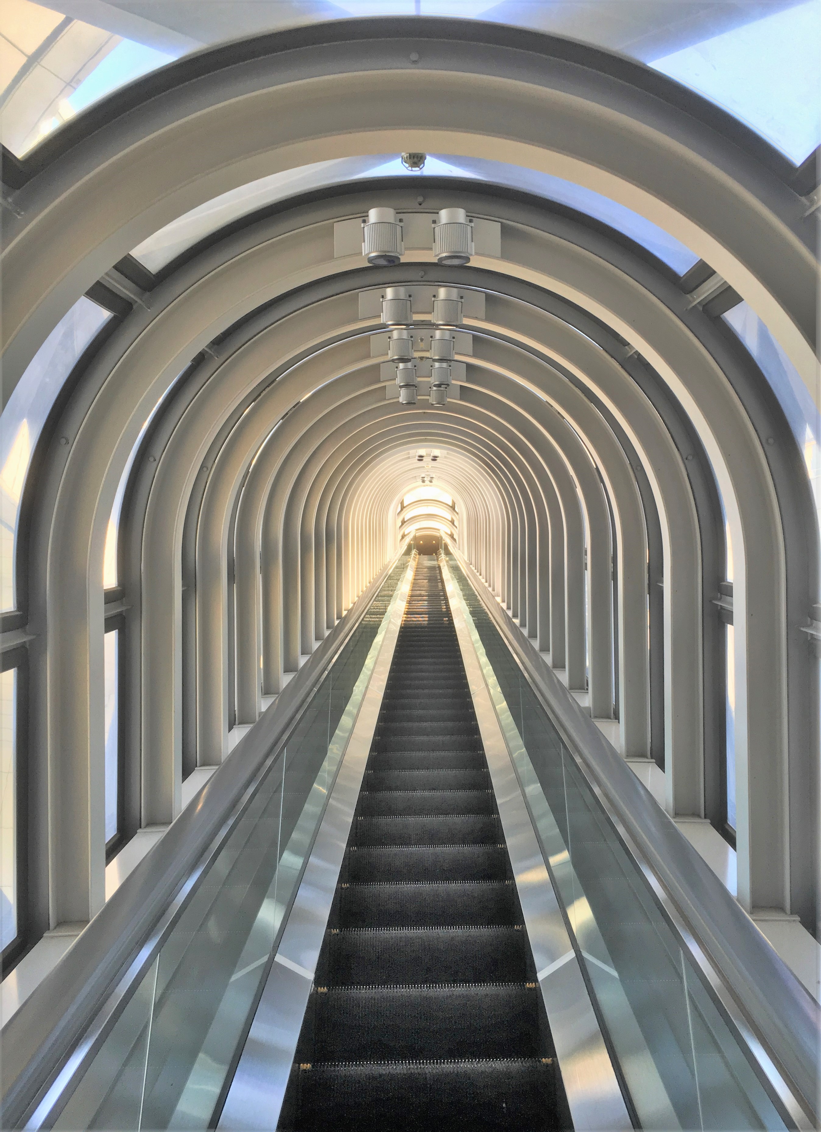 long escalator leading up to umeda sky building observation deck
