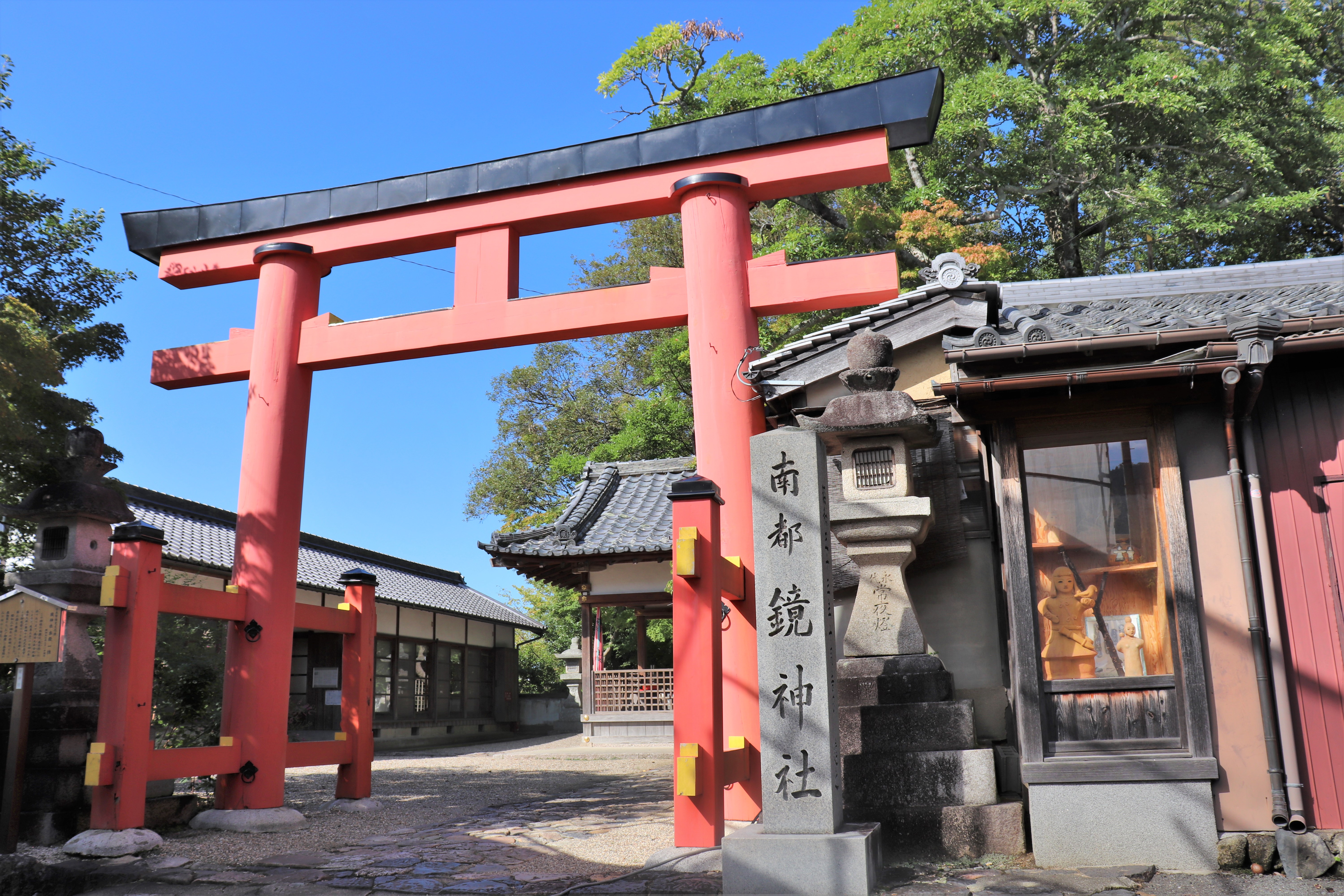 vermillion torii at the entrance of Kagami shrine in nara 
