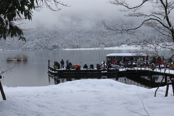 People enjoying smelt fishing in Lake Yogo, Shiga, Japan