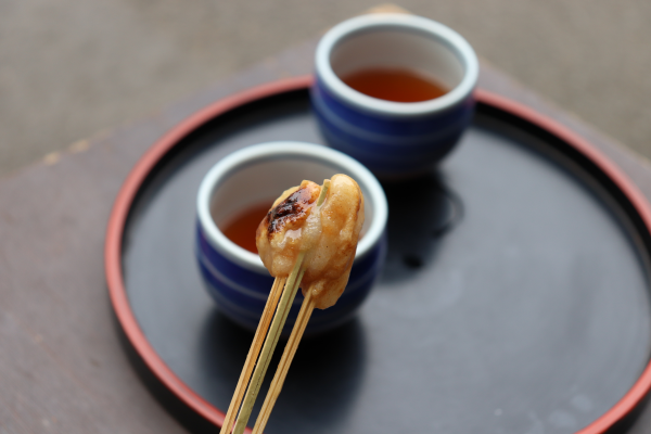 Aburi mochi a classic Kyoto traditional mochi coated with kinako and sweet white miso near Imamiya Shrine.